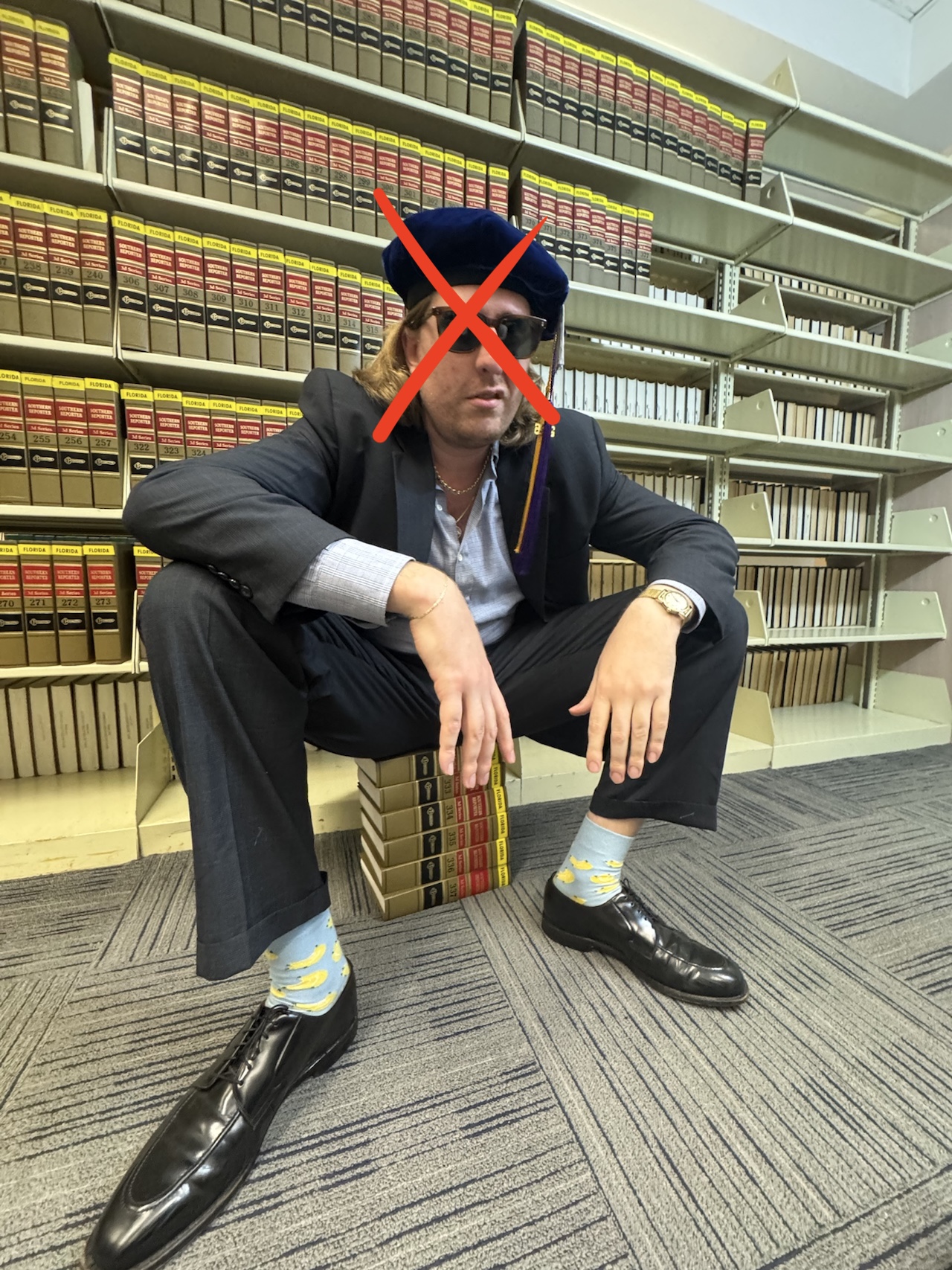 Exhibit A — Martin squatting on law books